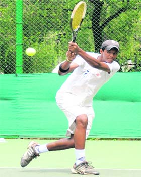 A player returns a shot during a match of the CLTA-AITA Championship Series Tennis Tournament at Sector 10, Chandigarh, on Sunday