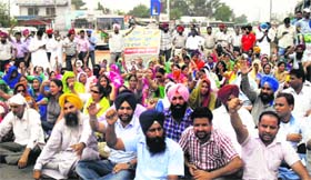 Members of the ETT Teachers Union block a highway during their protest at Kharar on Sunday