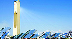 The PS 10 solar power plant concentrates sunlight from a field of heliostats onto a central solar power tower. The heat energy is used to drive a steam turbine to generate electricity