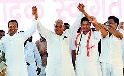 Former MP Naveen Jindal, Chief Minister Bhupinder Singh Hooda, HPCC President Ashok Tanwar, and CPS Vinod Bhayana at a state-level Vyapar Mandal Sammelan organised in Hisar on Sunday