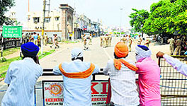 a view of a deserted road outside the gurdwara on the second day of the dharna
