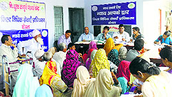CJM Gagandeep Mittal (centre) and paralegal volunteers during a legal literacy camp held in Kaithal on Sunday