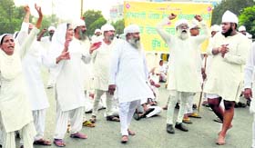 Namdharis block the Ferozepur road near Mini Secretariat in Ludhiana on Sunday.