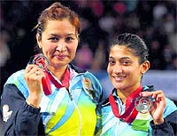 Jwala Gutta and A Ponnappa pose with their silver medals on Sunday