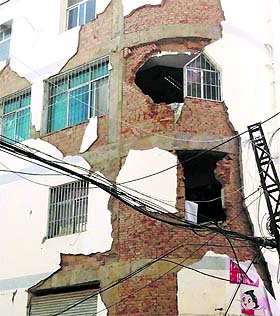 A building is damaged after an earthquake hit Ludian county, Yunnan province, on Sunday. 
