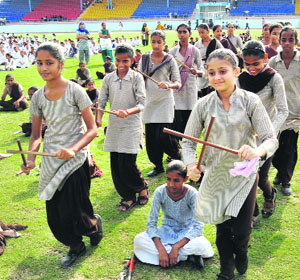 Students rehearse for Independence Day celebrations at the multipurpose stadium in Bathinda on Monday.