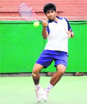 Top seed Vikrant Dahiya returns a shot during a semifinal match of the CLTA-AITA Championship Series Tennis Tournament at the CLTA, Chandigarh, on Monday.