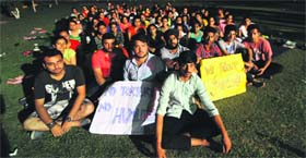 Students stage a protest against the warden of the girls hostel at SD College on Monday.