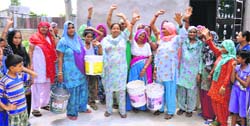 Residents of Tilla Mohalla protest water shortage in Jhajjar on Monday. A Tribune photo