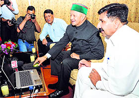 Chief Minister Virbhadra Singh launches a website of the I&PR Department at Oak Over in Shimla on Monday. I&PR Minister Mukesh Agnihotri is also seen in the picture. 