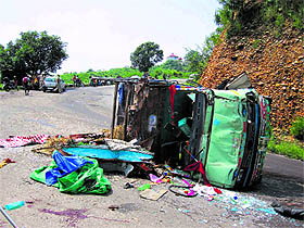 The tempo involved in the accident lies overturned at Dhaliara in Kangra on Monday