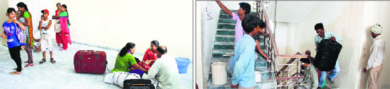 Parents sit on the floor of Meritorious School in Jalandhar on Monday; and (right) work at the hostel of the school in progress even as classes were supoosed to start from Monday.