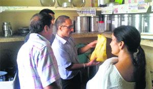 Health officials inspect Gandhi Vanita Ashram during a surprise visit on Monday. 