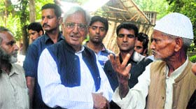 PDP patron Mufti Mohammad Sayeed meets party supporters in Anantnag district on Monday.
