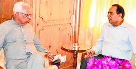 Kashmir Divisional Commissioner Rohit Kansal with Governor NN Vohra at Raj Bhawan in Srinagar on Monday.