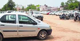 Parking attendants at Books Market charge visitors at whims