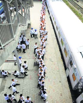 Children’s train vs science express: Schoolchildren queue up on the platform where Science Express has been stationed in Ludhiana