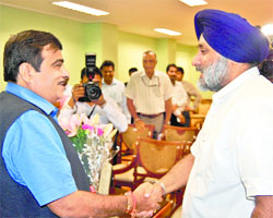 Punjab Deputy Chief Minister Sukhbir Badal with Union Minister Nitin Gadkari in New Delhi on Monday.