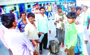 Bihar residents arrive at the Rajpura railway station on Monday.