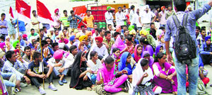 Students protest outside the district administrative complex in Sangrur on Monday.
