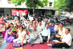 Ministerial collectorate employees hold a dharna in Dehradun on Monday