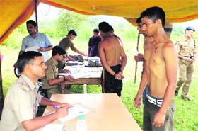 An applicant for the post of constable undergoes a physical test at the Police Lines, Roshanabad, in Haridwar on Monday