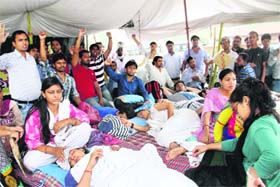 UP in arms: Contractual polytechnic lecturers who are on a hunger strike in support of their demands in Dehradun on Monday