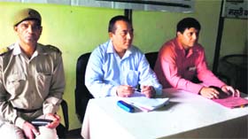 Forest officials hold a meeting to pacify the agitating villagers in Mussoorie on Monday