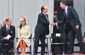 (From left) Britains Prince William and his wife Catherine take their seats as French President Francois Hollande shakes hands with Spains King Felipe (R) as they arrive to attend commemorations marking 100 years since the invasion of Belgium by Germany at the start of World War I, in Liege, on Monday.