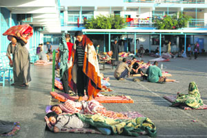 Displaced Palestinians sleep at a UN school in Beit Lahia in the northern Gaza Strip on Monday.