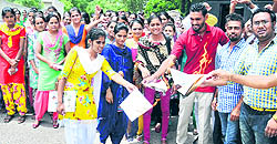 Members of the Punjab Students Union (Shaheed Randhawa) burn copies of the newly introduced Act by the state government in Bathinda on Tuesday
