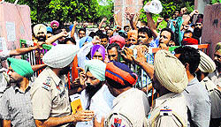 Police close the gate of Childrens Park while unemployed linesmen hold a protest march in Bathinda on Tuesday