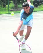 Digvijay Pratap attempts to return the ball during the final match of the CLTA-AITA Championship Series Tennis Tournament in Chandigarh on Tuesday. Tribune Photo: Pradeep Tewari