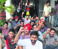 PUSU activists stage a dharna at Panjab University in Chandigarh on Tuesday. Tribune Photo: S Chandan.