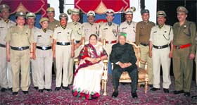Governor Urmila Singh and Chief Minister Virbhadra Singh on the occasion of the investiture ceremony at the Raj Bhawan in Shimla on Tuesday.