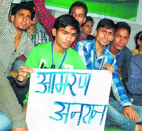 NSUI activist Avinash Kumar sits on an indefinite fast at the PG College in Dharamsala on Tuesday.