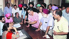 Traders demand suspension of ETO from DETC Sarojini Gautam Sharda in Jalandhar on Tuesday.
