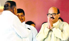 Samajwadi Party president Mulayam Singh Yadav and Amar Singh greet each other at a function in Lucknow on Tuesday.