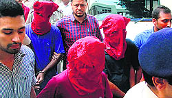 The arrested terrorists (in masks) being produced in a Jalandhar court on Tuesday