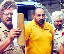 Jagdish Bhola, alleged kingpin of the multi-crore drug racket, outside a court in Mohali on Tuesday