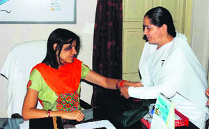 Sister Meena of Braham Kumari Ishwariya Vishwavidhyalya ties rakhi on the hand of MNA Vipra Trivedi in Haridwar on Tuesday.