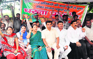 BJP councillors stage a protest against Mukhya Nagar Adhikari Vipra Trivedi on the Municipal Corporation office premise in Haridwar on Tuesday.