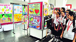 Students admire posters on organ donation displayed at an exhibition at the PGI in Chandigarh on Wednesday