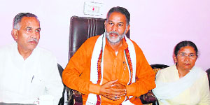 BJP state chief Ram Bilas Sharma (centre) talks to the media in Mahendragarh on Tuesday.