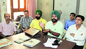 Officers, who are on pen-down strike after Tuesdays protest by the traders, express their grievances in Jalandhar on Wednesday