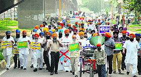 Sikh Talmet Committee and other Sikh organisations carry out a protest march following remarks by RSS chief Mohan Bhagwat in Jalandhar on Wednesday. 
