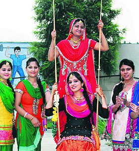 Students of CT Group of Institutions celebrate the Teej festival in a traditional way in Jalandhar on Wednesday. 