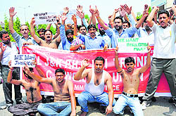 Members of the J&K PHE ITI Trained and CP Workers Union protest in Jammu on Wednesday