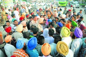 Police try to pacify the relatives of ex-model Shina on Gill road in Ludhiana on Wednesday