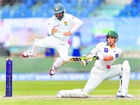Sri Lanka's Kaushal Silva jumps as Pak captain Misbah-ul-Haq plays a shot in Galle on Wednesday